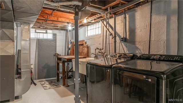610 Huth Rd, Cheektowaga, NY 14225 - laundry room with washing machine and dryer, plenty of natural light, and heating unit