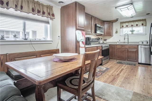 225 Breen Ave, Watertown-City, NY 13601 - kitchen with stainless steel appliances, plenty of natural light, light wood-style flooring, and light countertops