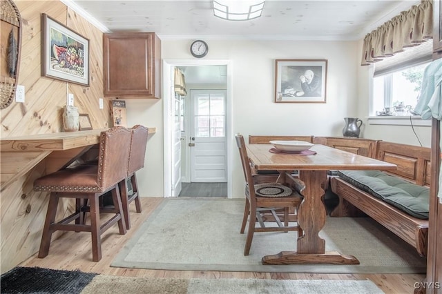 225 Breen Ave, Watertown-City, NY 13601 - dining area featuring breakfast area, wood finished floors, healthy amount of natural light, and ornamental molding