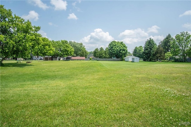 225 Breen Ave, Watertown-City, NY 13601 - view of green lawn featuring an outdoor structure