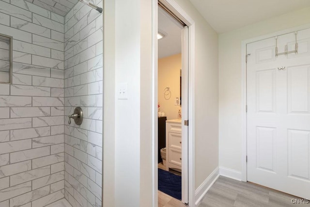 13 Berrywood Rd, Clay, NY 13090 - bathroom with tiled shower, wood finished floors, and vanity