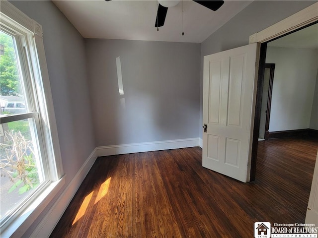 116 Park St, Jamestown, NY 14701 - unfurnished room featuring dark wood-type flooring, a ceiling fan, and vaulted ceiling