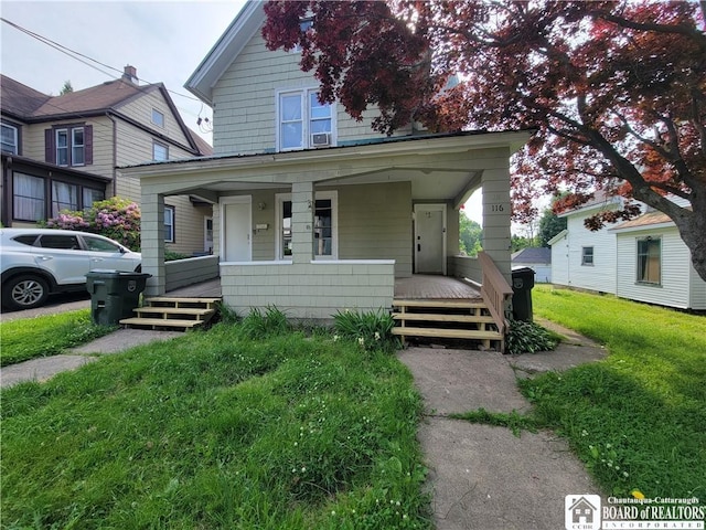 116 Park St, Jamestown, NY 14701 - traditional style home with a porch and a front lawn