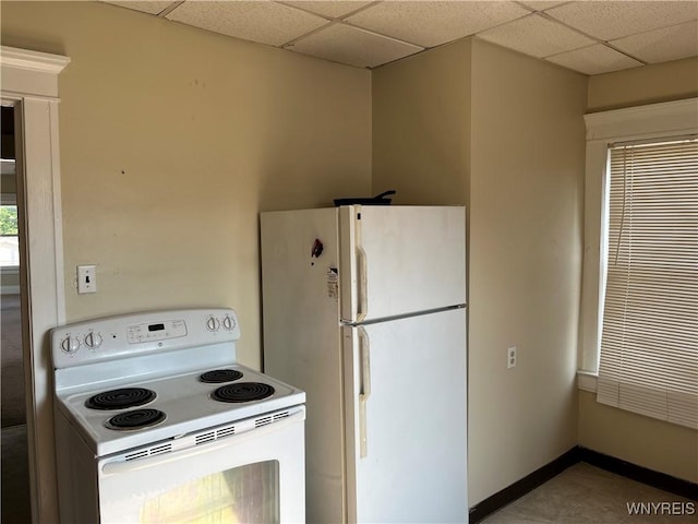600 Cayuga Dr, Niagara Falls, NY 14304 - kitchen featuring white appliances and a paneled ceiling