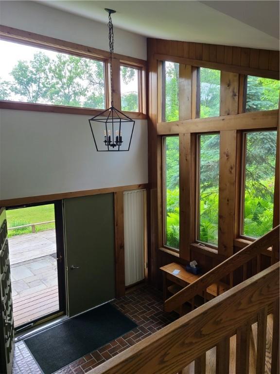 1324 New Seabury Ln, Victor, NY 14564 - entrance foyer with brick patterned floors and a chandelier