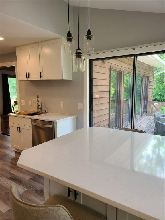 1324 New Seabury Ln, Victor, NY 14564 - kitchen with stainless steel dishwasher, plenty of natural light, dark wood finished floors, white cabinets, and lofted ceiling