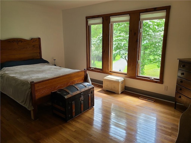 1324 New Seabury Ln, Victor, NY 14564 - bedroom featuring multiple windows and hardwood / wood-style floors