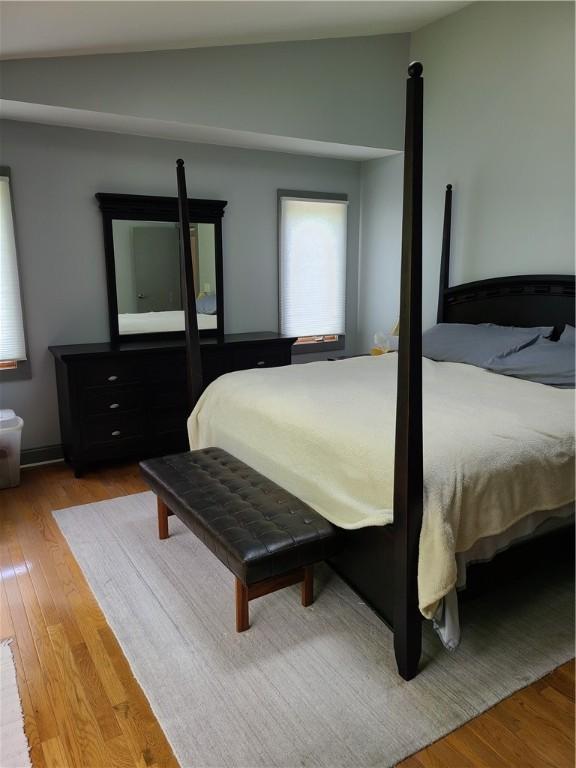 1324 New Seabury Ln, Victor, NY 14564 - bedroom featuring vaulted ceiling and wood finished floors