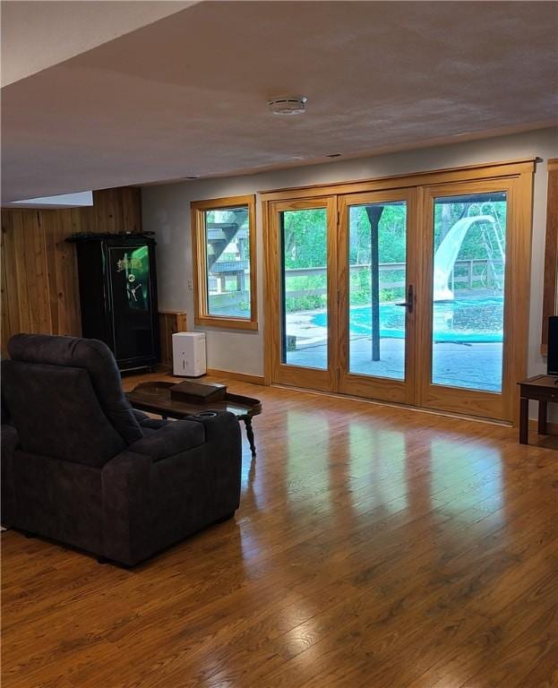 1324 New Seabury Ln, Victor, NY 14564 - living room featuring wood finished floors and wooden walls