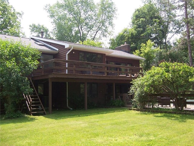 1324 New Seabury Ln, Victor, NY 14564 - rear view of house featuring a chimney, a deck, stairway, and a yard