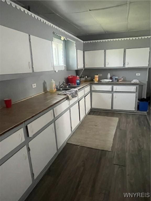 129 Liddell St, Buffalo, NY 14212 - kitchen with dark wood-style floors, white cabinets, and dark countertops