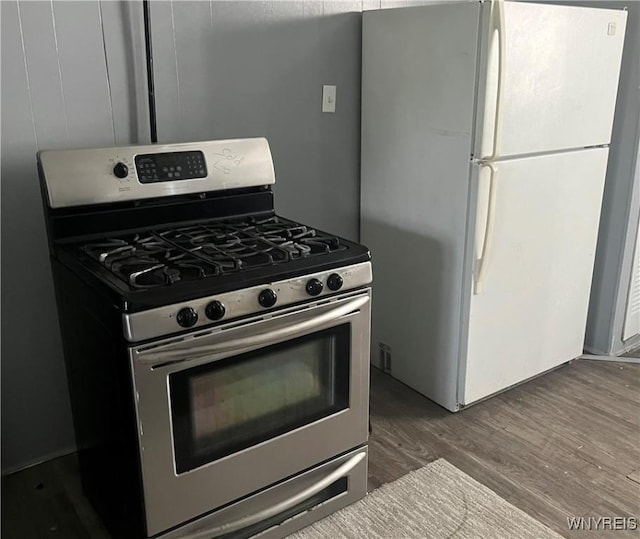 129 Liddell St, Buffalo, NY 14212 - kitchen with freestanding refrigerator, gas range, and wood finished floors