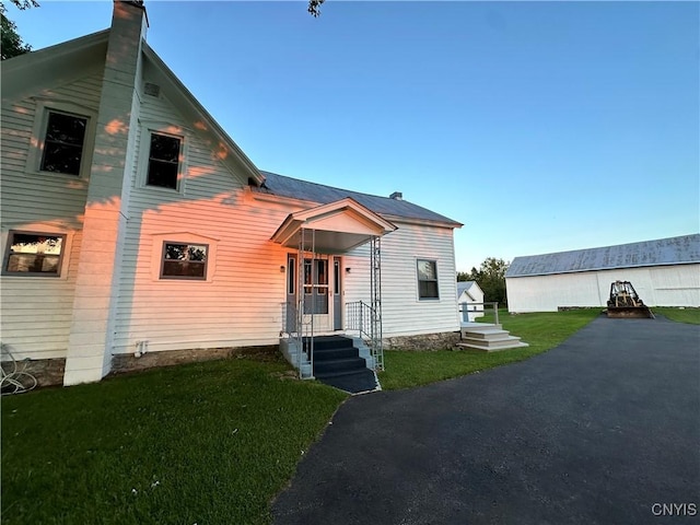 4076 State Highway 37, Morristown, NY 13669 - view of front of home featuring a front lawn and a chimney