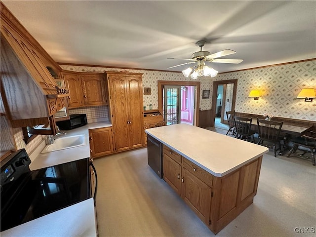 4076 State Highway 37, Morristown, NY 13669 - kitchen with black appliances, wallpapered walls, brown cabinets, light countertops, and a kitchen island