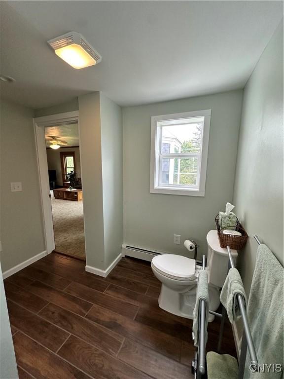 4076 State Highway 37, Morristown, NY 13669 - bathroom with wood finished floors and a baseboard heating unit