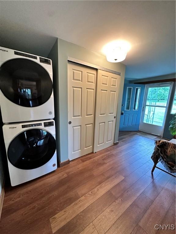 4076 State Highway 37, Morristown, NY 13669 - laundry area with stacked washing machine and dryer and wood finished floors