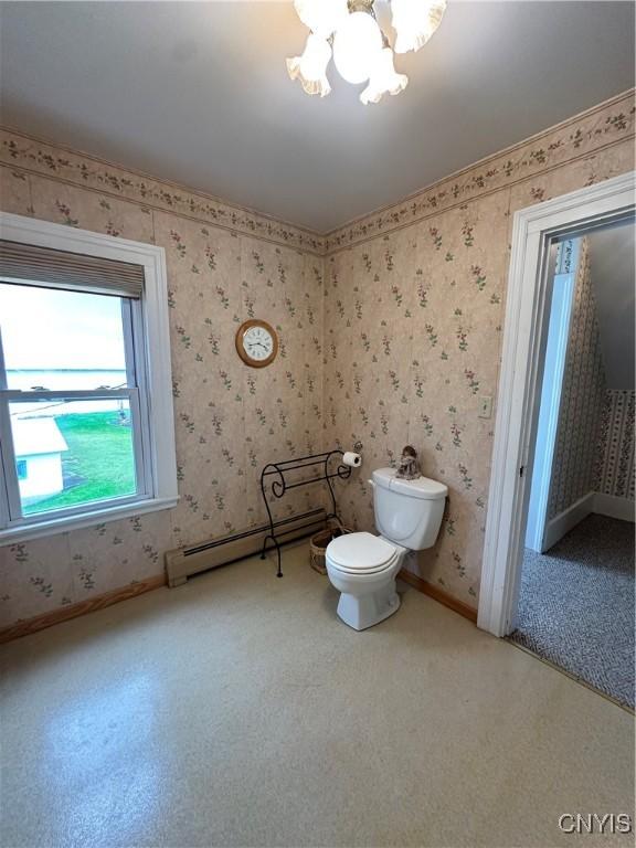 4076 State Highway 37, Morristown, NY 13669 - bathroom featuring a baseboard radiator, a chandelier, and wallpapered walls