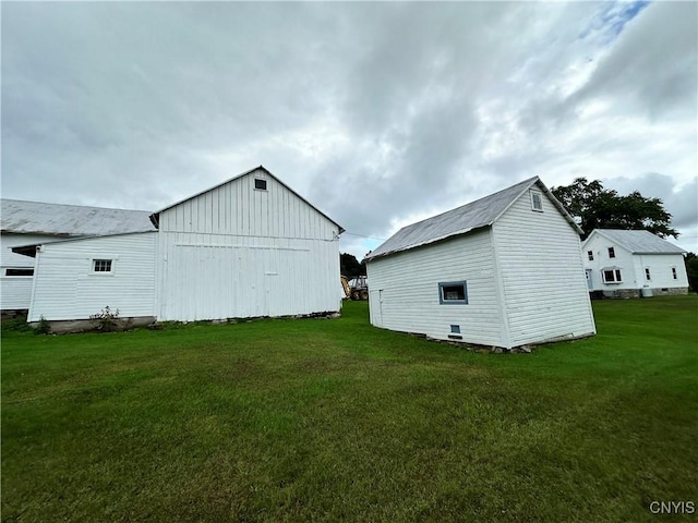 4076 State Highway 37, Morristown, NY 13669 - view of side of home with an outdoor structure and a yard