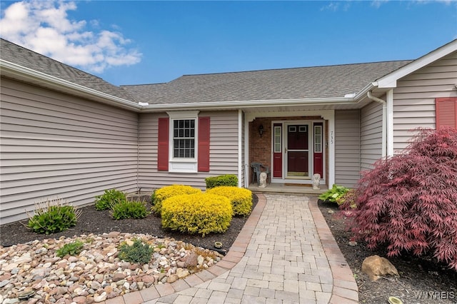 735 Pletcher Rd, Lewiston, NY 14092 - view of exterior entry featuring roof with shingles