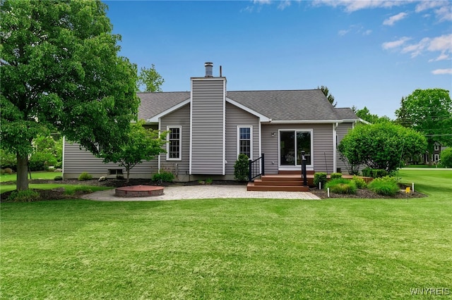 735 Pletcher Rd, Lewiston, NY 14092 - back of property with a yard, a chimney, and roof with shingles