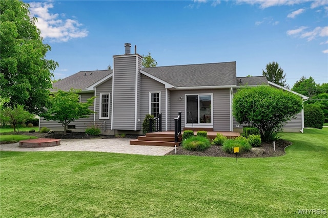 735 Pletcher Rd, Lewiston, NY 14092 - back of house with a patio, a yard, a shingled roof, a chimney, and a deck