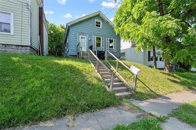 207 Boyden St, Syracuse, NY 13203 - bungalow-style home with a front yard and entry steps