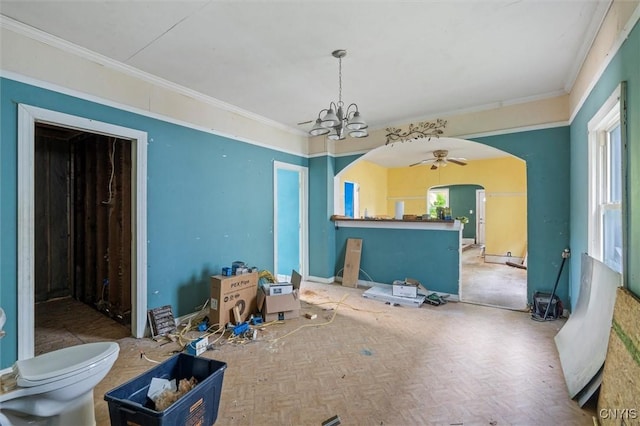 207 Boyden St, Syracuse, NY 13203 - dining area featuring arched walkways, crown molding, a chandelier, and a ceiling fan