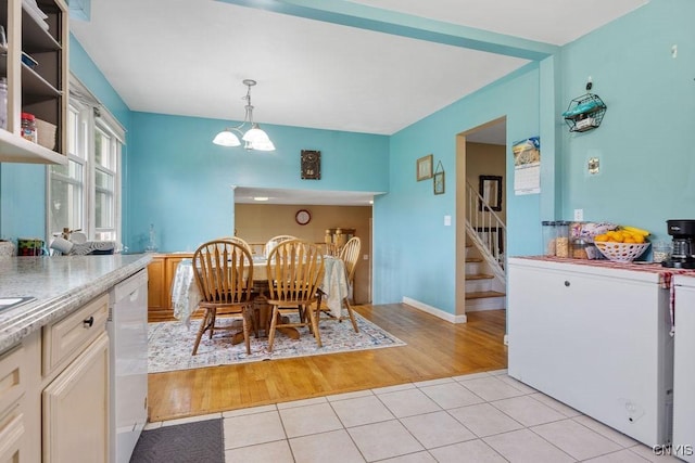 17 Hummingbird Pl, Clay, NY 13090 - dining area featuring a chandelier, stairway, and light tile patterned floors