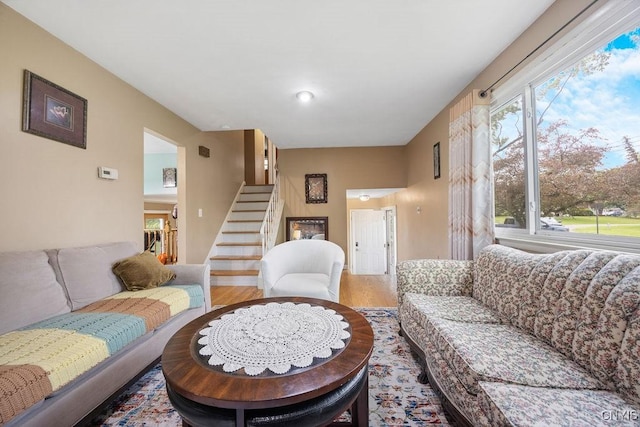 17 Hummingbird Pl, Clay, NY 13090 - living area with stairway and wood finished floors