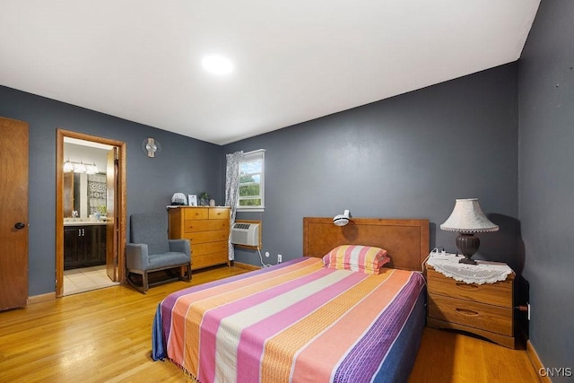 17 Hummingbird Pl, Clay, NY 13090 - bedroom with light wood-type flooring, ensuite bath, and a wall mounted air conditioner