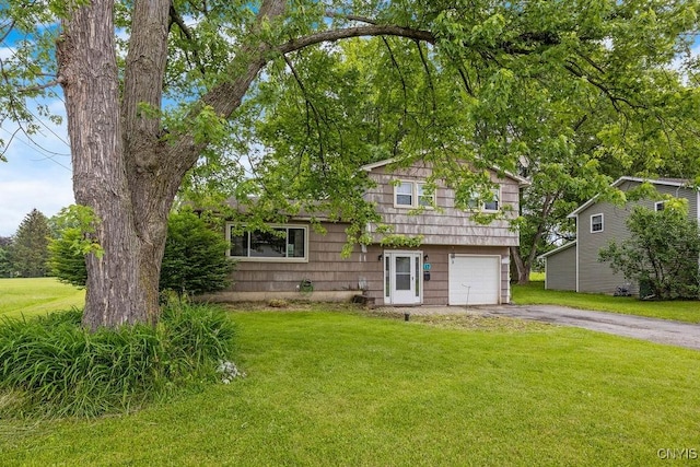 17 Hummingbird Pl, Clay, NY 13090 - view of front of property featuring asphalt driveway, a front yard, and an attached garage