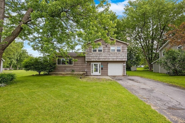 17 Hummingbird Pl, Clay, NY 13090 - tri-level home with driveway, a front yard, and an attached garage