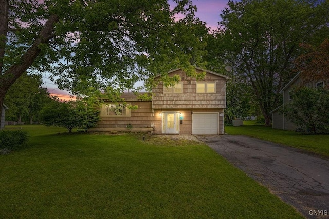17 Hummingbird Pl, Clay, NY 13090 - split level home with asphalt driveway, an attached garage, and a lawn