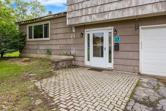 17 Hummingbird Pl, Clay, NY 13090 - entrance to property with a garage and a patio area