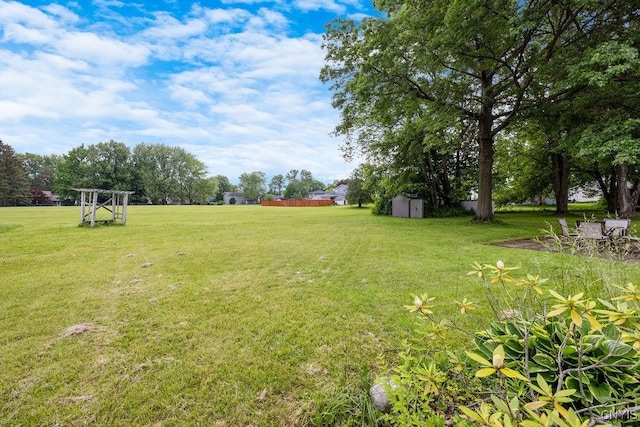 17 Hummingbird Pl, Clay, NY 13090 - view of green lawn featuring a storage unit