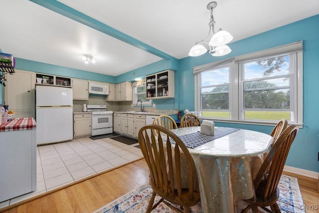17 Hummingbird Pl, Clay, NY 13090 - dining room with a chandelier and light wood-style flooring