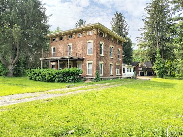 756 Herkimer Rd, Utica, NY 13502 - view of front facade with a front yard and brick siding