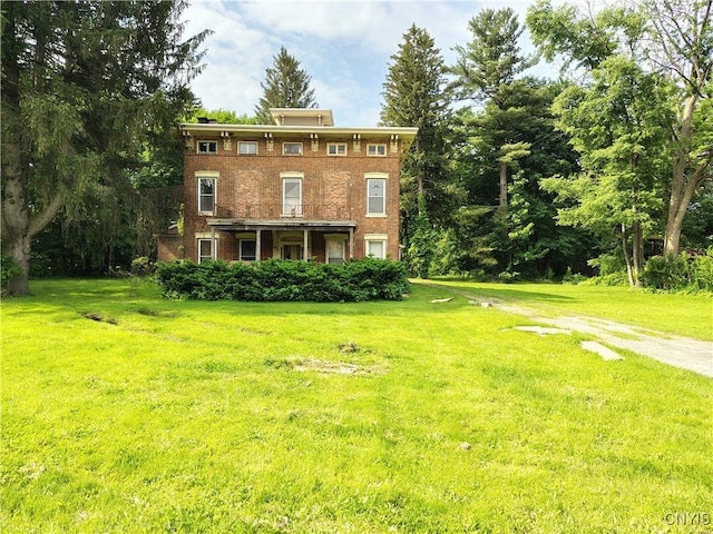 756 Herkimer Rd, Utica, NY 13502 - view of front of house with a front yard and brick siding