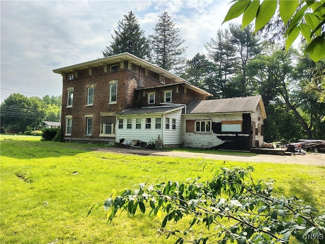 756 Herkimer Rd, Utica, NY 13502 - back of property featuring a yard and brick siding