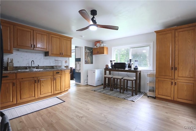 31768 Wilton Rd, Rutland, NY 13619 - kitchen featuring brown cabinetry and light wood-style flooring