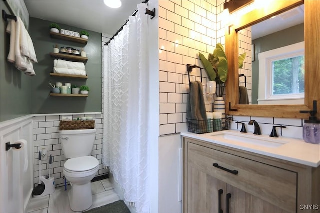 31768 Wilton Rd, Rutland, NY 13619 - bathroom featuring vanity, tile patterned floors, a wainscoted wall, and a shower with curtain