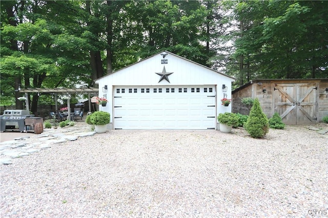 31768 Wilton Rd, Rutland, NY 13619 - detached garage with view of wooded area