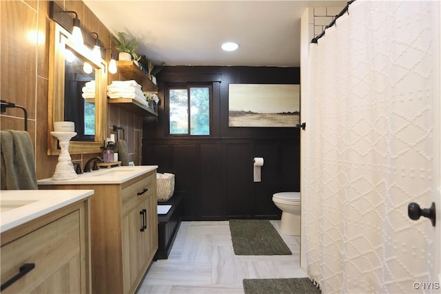 31768 Wilton Rd, Rutland, NY 13619 - bathroom featuring two vanities, recessed lighting, and a decorative wall