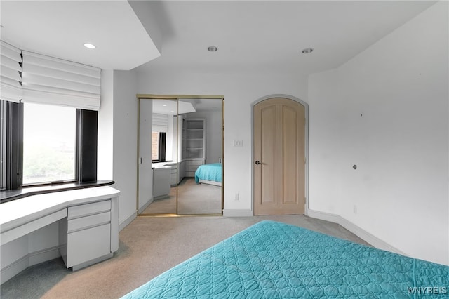 40 Waterfront Cir, Buffalo, NY 14202 - bedroom with light carpet, recessed lighting, and a closet