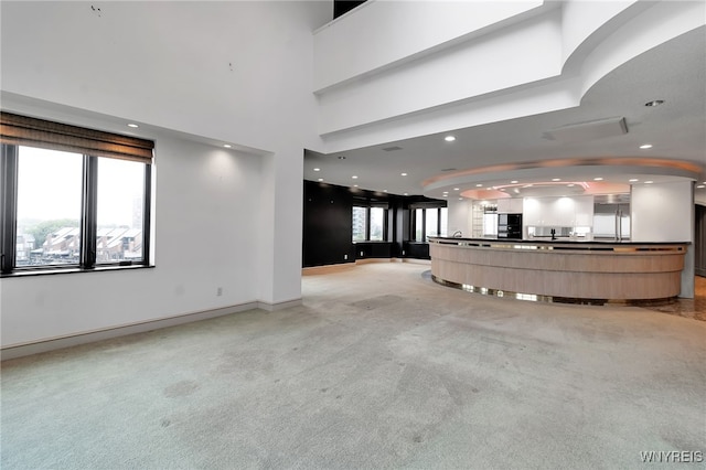 40 Waterfront Cir, Buffalo, NY 14202 - unfurnished living room featuring light carpet and recessed lighting