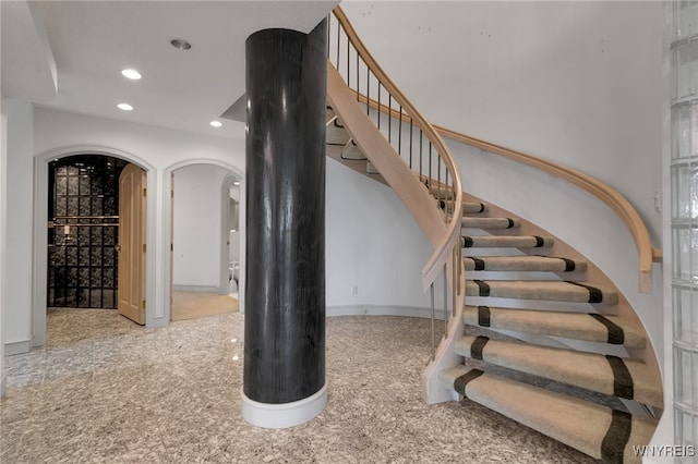 40 Waterfront Cir, Buffalo, NY 14202 - staircase featuring arched walkways, recessed lighting, and carpet