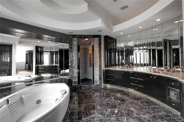 40 Waterfront Cir, Buffalo, NY 14202 - full bathroom with vanity, a jetted tub, recessed lighting, and marble tiled flooring