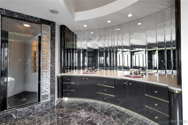 40 Waterfront Cir, Buffalo, NY 14202 - bathroom featuring marble tiled flooring, double vanity, a shower stall, and recessed lighting