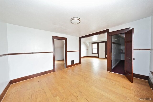 377 Pine Ridge Rd, Cheektowaga, NY 14225 - empty room with light wood-style flooring and baseboards