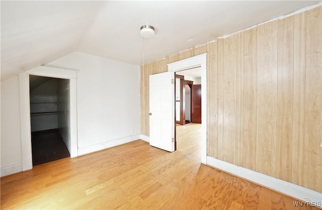 377 Pine Ridge Rd, Cheektowaga, NY 14225 - spare room featuring light wood-type flooring and lofted ceiling